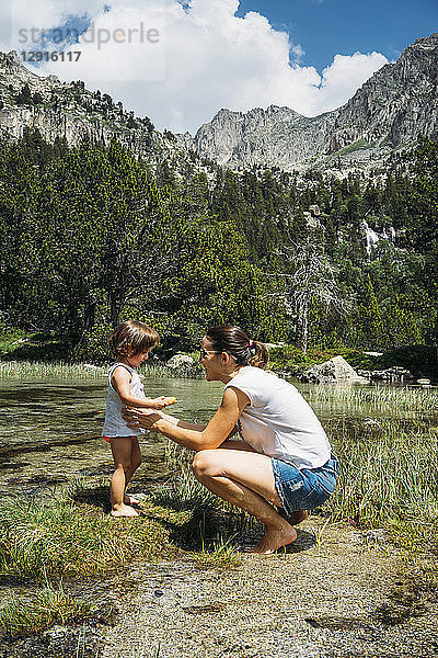 Spain  Mother and toddler exploring lakes in the Pyrenees