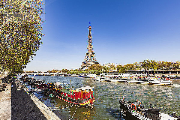 France  Paris  Eiffel Tower and tour boat on Seine river