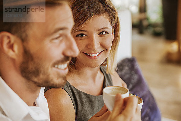 Portrait of smiling couple in a cafe