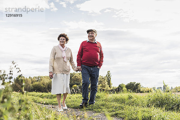 Senior couple on a walk in rural landscape