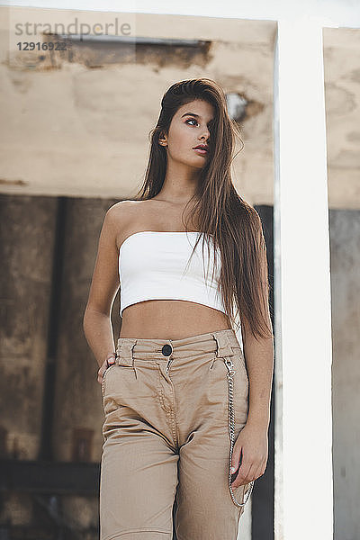 Portrait of a fashionable teenage girl with long brown hair