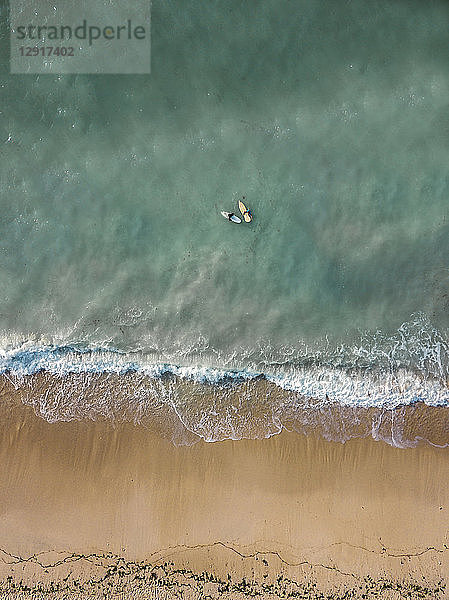 Indonesia  Bali  Aerial view of Pandawa beach  two surfers