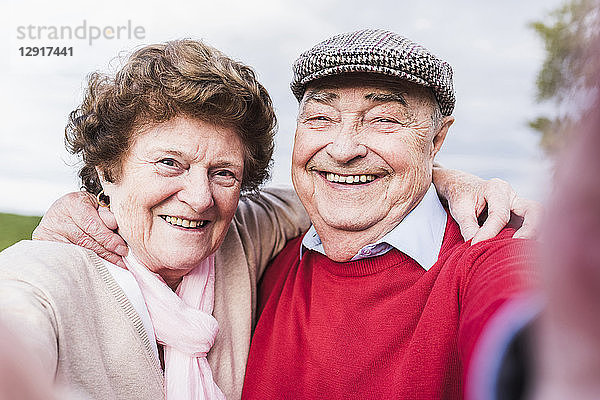 Selfie of happy senior couple outdoors