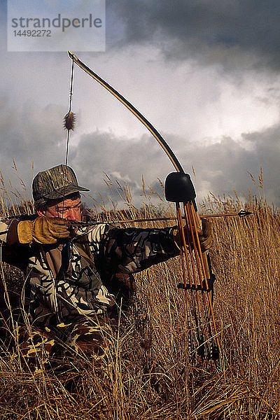 Kodiak Bowhunter Handmade Longbow Tundra Sky Clouds AK Southwest Fall Portrait Mann Gras