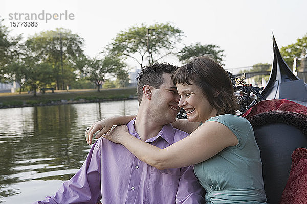 Mid adult couple romancing in a gondola