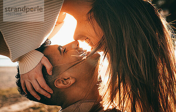 Lovely Shot Of A Young Couple In Love At Sunset