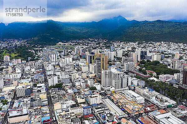 Cityscape against scenic view of mountain range at Port Louis  Mauritius