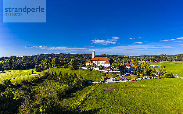 Germany Bavaria  Sachsenkam  Aerial view of Reutberg monastery in summer rural landscape