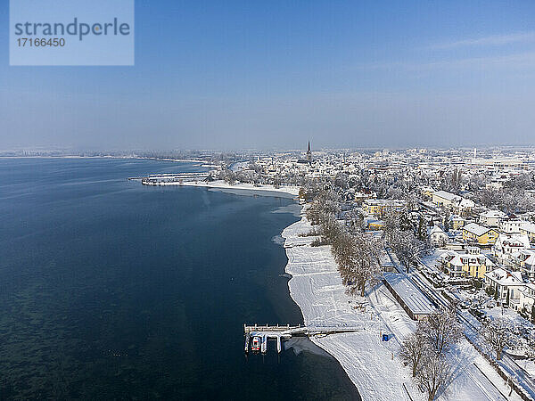 Germany  Baden-Wurttemberg  Radolfzell  Aerial view of snow-covered town on shore of Lake Constance