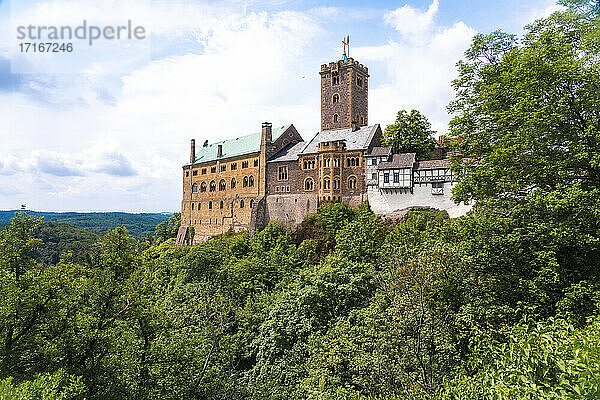 Wartburg Castle by Thuringer forest against cloudy sky at Eisenach  Germany