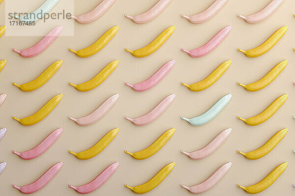 Three dimensional render of pastel colored bananas