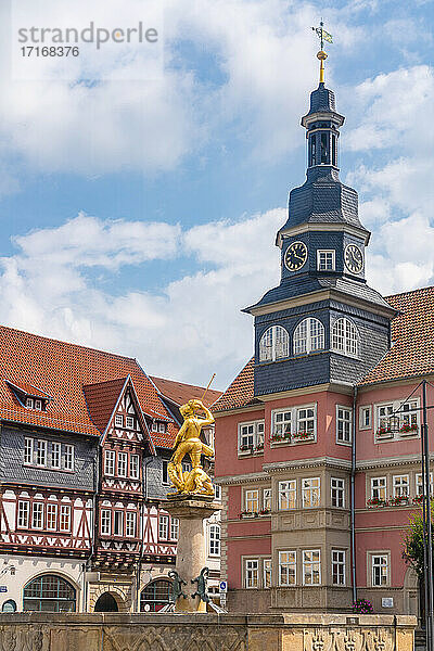 St. George Fountain by church amidst historic houses in Market Square at Eisenach  Germany