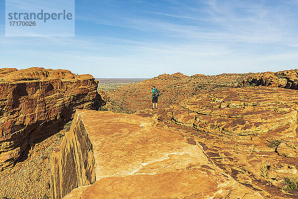 Male hiker photographing landscape of Kings Canyon