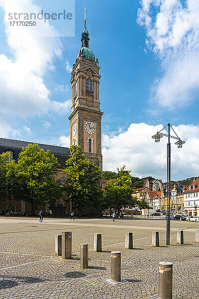 Clock tower of St George's Church against cloudy sky in Market Square at Eisenach  Germany