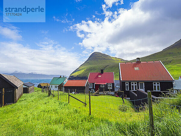 Exterior of houses at Gjogv village against sky  Eysturoy  Faroe Islands  Iceland