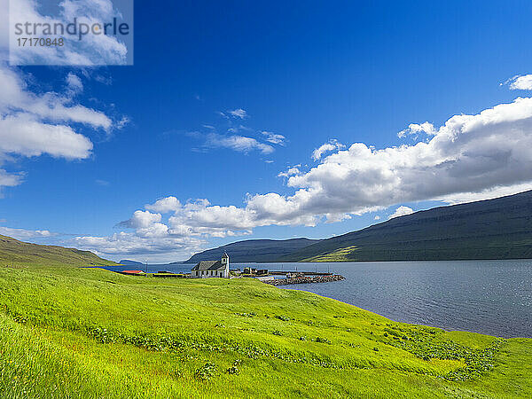 Tranquil scene of sea against blue sky on sunny day  Iceland