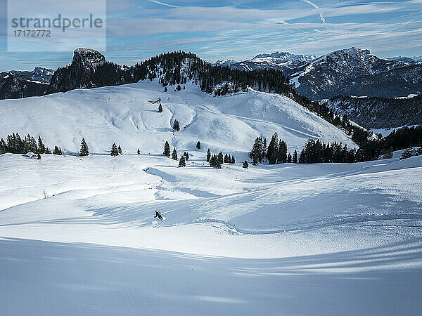 Man skiing on snow covered Karkopf  Lattengeburge  Berchtesgadenerland  Germany