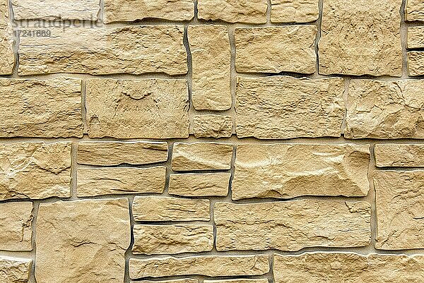 Künstliche Steinmauer  imitierter Naturstein aus Kunststoff  Hintergrundbild