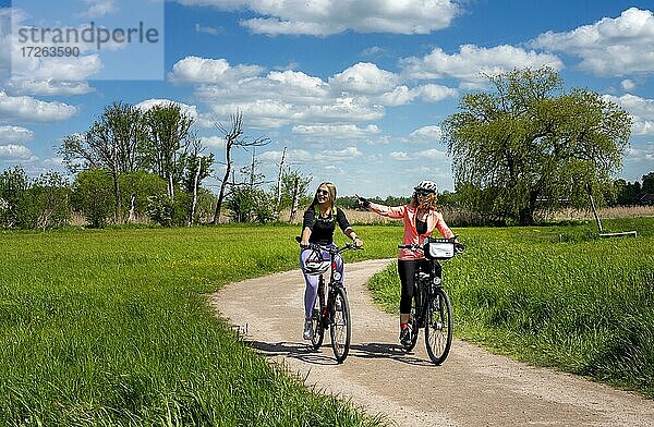 Girlfriends on a bike ride in the north of Berlin  Berlin  Germany