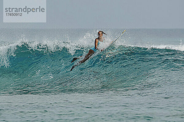 Female Surfer in Indian Ocean  Maldives