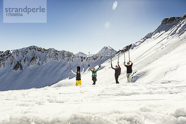Group of happy friends on a ski tour in winter  Achenkirch  Austria