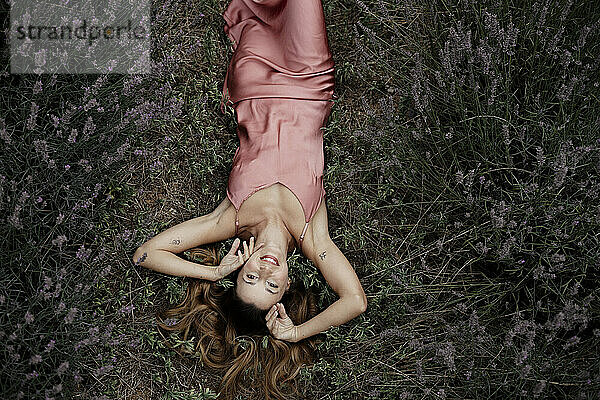 Woman lying in lavender field