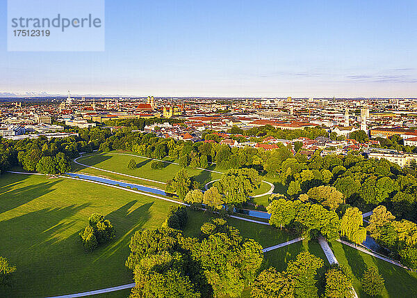Germany  Bavaria  Munich  Aerial view of clear sky over Schwabinger Bach stream flowing through English Garden at dusk