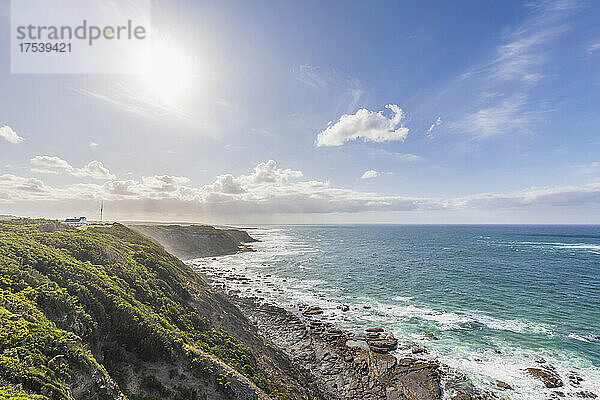 Sun shining over coastal landscape along Great Ocean Road