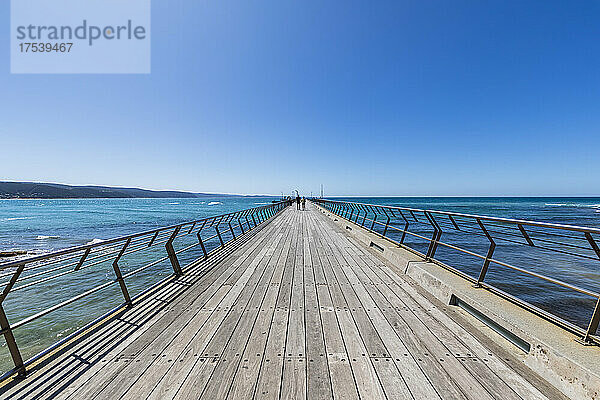 Australia  Victoria  Lorne  Clear blue sky over pier of coastal town on Louttit Bay