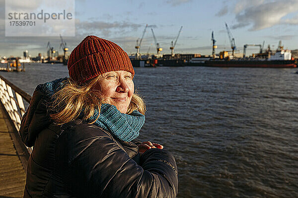 Senior woman by Elbe river on sunny day