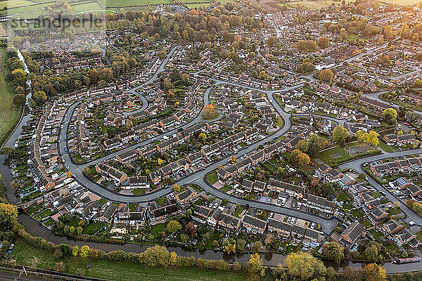 UK  England  Whittington  Aerial view of riverside town at dusk