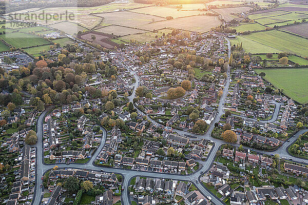 UK  England  Whittington  Aerial view of town at autumn dusk