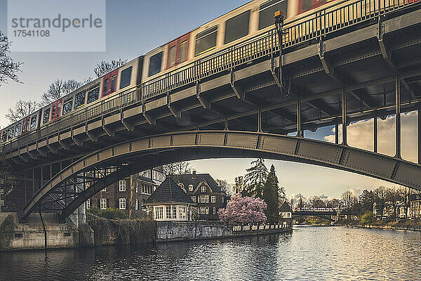 Germany  Hamburg  Train crossing bridge over Alster canal