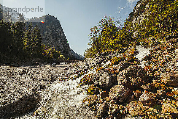 Alpine stream flowing between rocks