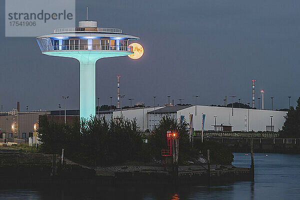 Germany  Hamburg  Lighthouse Zero building at night with ominous full moon in background