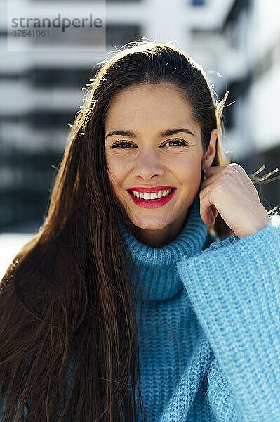 Happy beautiful woman wearing turtleneck sweater