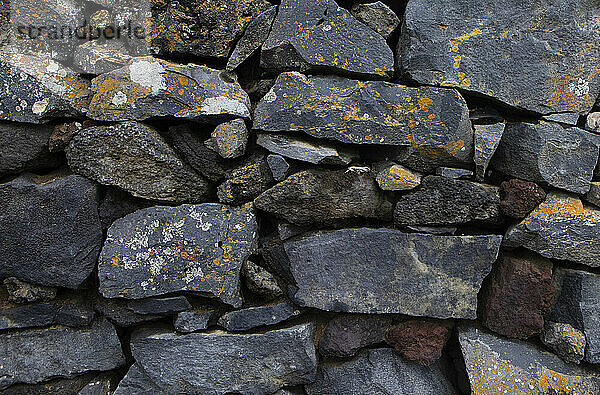 Volcanic rocks stack making stone wall