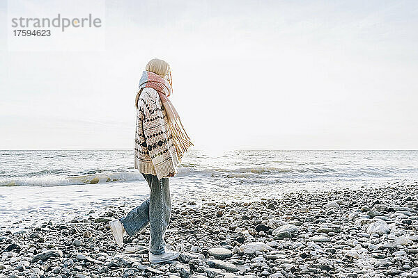 Teenage girl walking on stones at beach  Gagra  Abkhazia