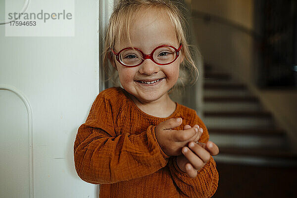 Cute girl with eyeglasses at home
