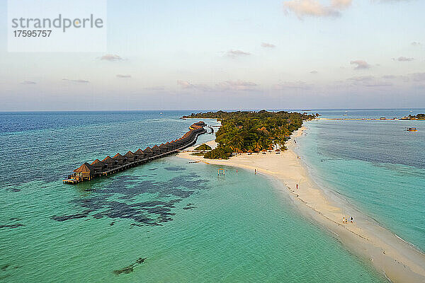 Maldives  Lhaviyani Atoll  Kuredu  Helicopter view of sandy beach and resort bungalows at dawn