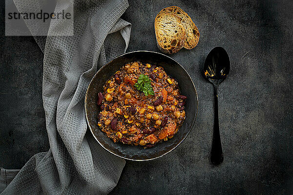 Studio shot of bowl of vegan quinoa stew with vegetables and chick-peas