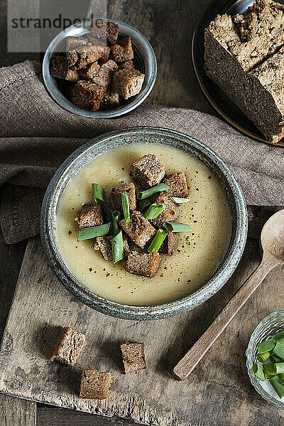 Homemade Jerusalem Artichoke soup garnished with croutons in bowl