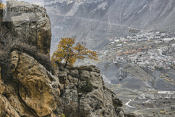 Russia  Dagestan  Chokh  Secluded village in autumn with mountain in foreground