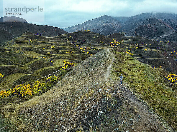 Woman standing on terraced field at North Caucasus  Dagestan  Russia