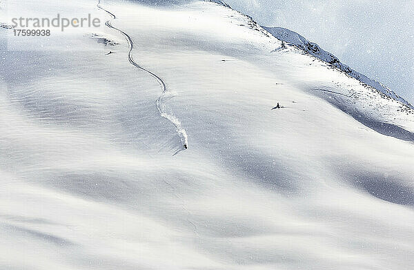Young man skiing on snow covered mountain  Tyrol  Austria
