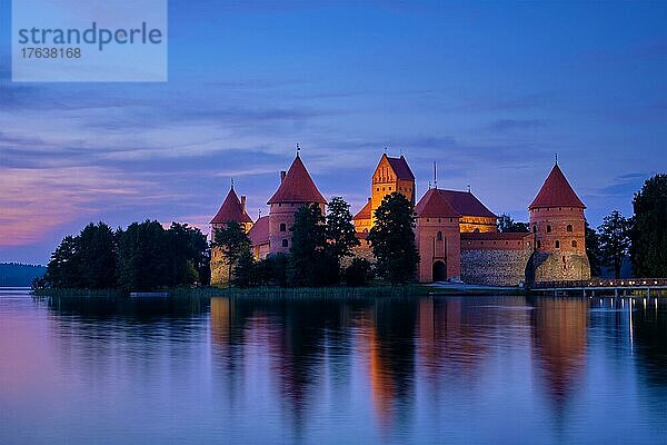 Night view of Trakai Island Castle in lake Galve illuminated in the evening  Lithuania