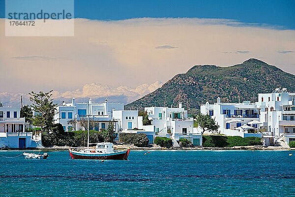 The beach and fishing village of Pollonia with fishing boats in sea. Pollonia town  Milos island  Greece