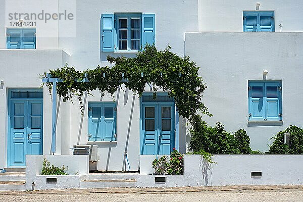 Traditional greek architecture  houses painted white with blue doors and window shutters. Pachena village  Milos island  Greece