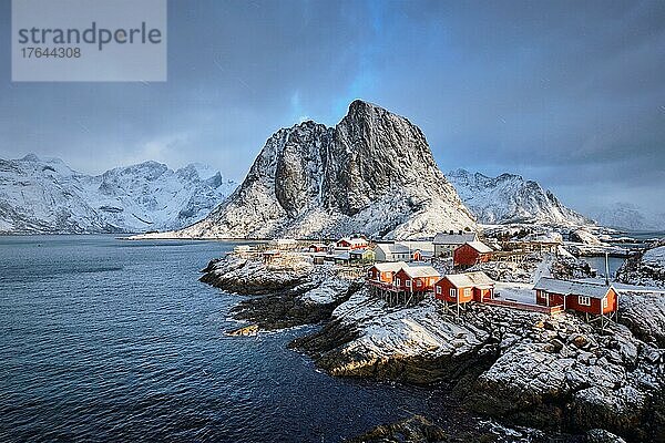 Famous tourist attraction Hamnoy fishing village on Lofoten Islands  Norway with red rorbu houses in winter