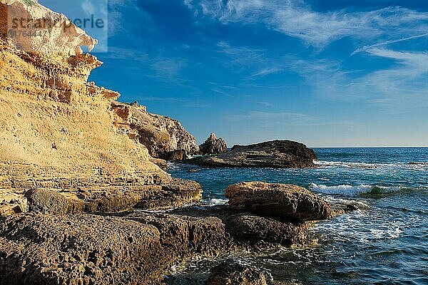 Fyriplaka beach and waves of Aegean sea on sunset  Milos island  Cyclades  Greece